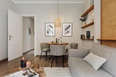 a dining room with a wooden table and chairs at Cadi - 1 bedroom apartment in Sant Gervasi in Barcelona
