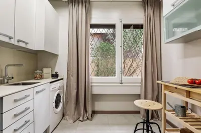 a living room with a couch and a table at Cadi - 1 bedroom apartment in Sant Gervasi in Barcelona
