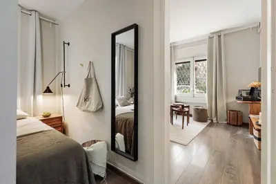 a bedroom with a bed and a mirror at Cadi - 1 bedroom apartment in Sant Gervasi in Barcelona