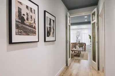 a hallway with white walls and a blue ceiling at Giralda - 3 bedrooms in Sagrada Família in Barcelona