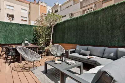 a living room with a couch and a table at Newman - 3 bedrooms and terrace in Sant Gervasi in Barcelona