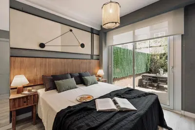 a desk in front of a window with a plant at Newman - 3 bedrooms and terrace in Sant Gervasi in Barcelona