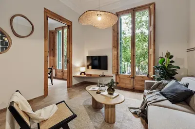 a living room with a couch and a table at Krasner - 3 bedrooms in Eixample Dreta in Barcelona