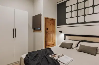 a hallway with a dresser and a living room at Krasner - 3 bedrooms in Eixample Dreta in Barcelona