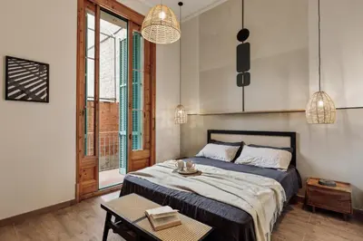 a living room with a couch and a table at Krasner - 3 bedrooms in Eixample Dreta in Barcelona