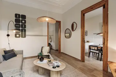 a dining room with a table and chairs and a kitchen at Krasner - 3 bedrooms in Eixample Dreta in Barcelona