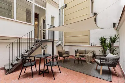 a bedroom with a bed and a large window at Gava - 3 bedrooms and terrace in Sagrada Família in Barcelona