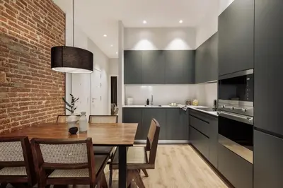 a bedroom with a bed and a toilet in a room at Gava - 3 bedrooms and terrace in Sagrada Família in Barcelona
