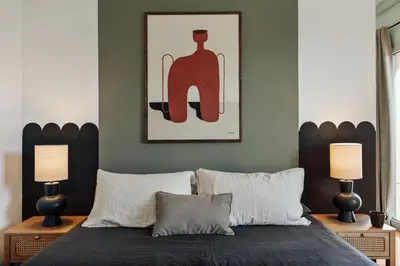 a bedroom with white walls and a large sliding door at Taksim - 2 bedrooms and balcony in La Barceloneta in Barcelona