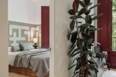 a living room with a table and a couch at Aire - 1 bedroom and balcony in Sant Antoni in Barcelona