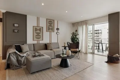 a living room with a couch and a table at Aymara - 5 bedrooms and terrace in Pedralbes in Barcelona