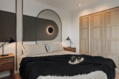 a bedroom with a bed with a table and a lamp at Aymara - 5 bedrooms and terrace in Pedralbes in Barcelona