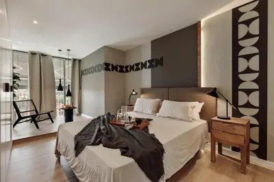a dining room and living room with a table and chairs at Aymara - 5 bedrooms and terrace in Pedralbes in Barcelona