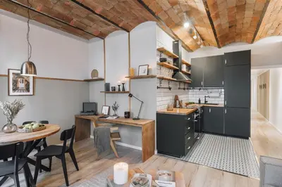 a bedroom with a bed and a chandelier at Senes - 2 bedrooms in Eixample Esquerra in Barcelona