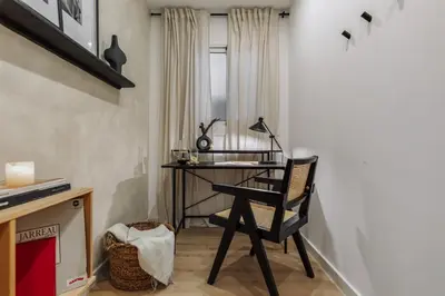 a mirror on a wall with a table with candles at Basquiat - 2 bedrooms and office in Sant Gervasi in Barcelona