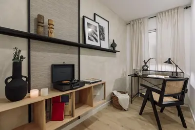 a living room with a couch and a table at Basquiat - 2 bedrooms and office in Sant Gervasi in Barcelona