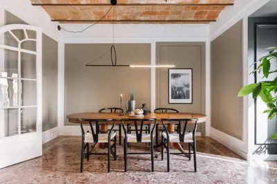 a bedroom with a bed and a wooden wall at Feliu - 2 bedrooms in Eixample Dreta in Barcelona