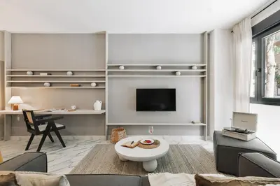 a living room with a couch and a table at Equense - 2 bedrooms in Sant Gervasi in Barcelona