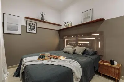 a living room with a white couch and a mirror at Incahuasi - 3 bedrooms and terrace in Eixample Esquerra in Barcelona