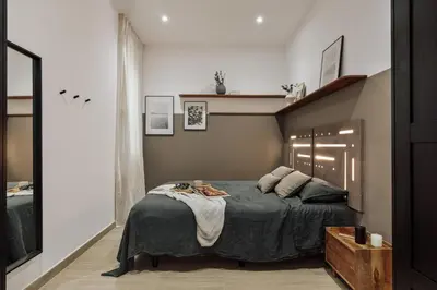 a living room with a couch and a table at Incahuasi - 3 bedrooms and terrace in Eixample Esquerra in Barcelona