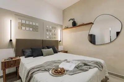 a dining room with a table and chairs and a tv at Incahuasi - 3 bedrooms and terrace in Eixample Esquerra in Barcelona