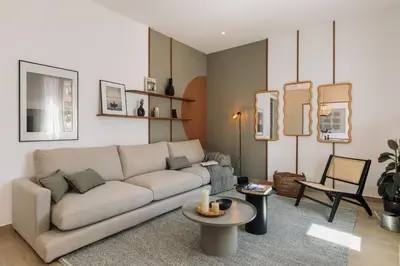 a patio with a couch and chairs and a table at Incahuasi - 3 bedrooms and terrace in Eixample Esquerra in Barcelona