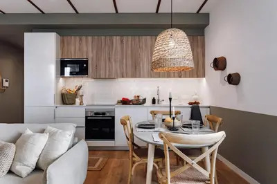 a living room with a couch and a table at Geranio - 1 bedroom in Eixample Esquerra in Barcelona