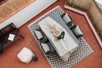 a living room with a couch and a table at Geranio - 1 bedroom in Eixample Esquerra in Barcelona
