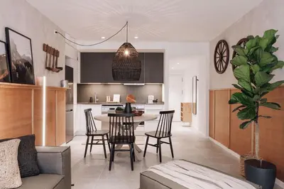 a living room with a table and chairs at Tibi - 2 bedrooms and office in Eixample Esquerra in Barcelona