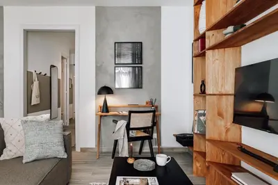 a hallway leading to a bedroom with a mirror at Ziga - 2 bedrooms in Sagrada Família in Barcelona