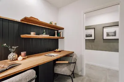 a living room with a tv on a wooden shelf at Olite - 2 bedrooms in Eixample Esquerra in Barcelona