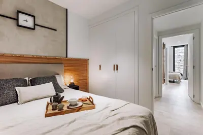 a hallway with three pictures on the wall at Olite - 2 bedrooms in Eixample Esquerra in Barcelona