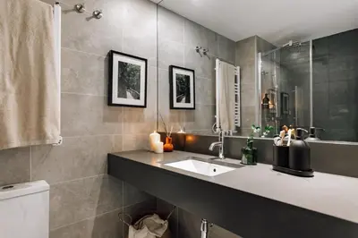 a bedroom with a bed and a sink and a mirror at Olite - 2 bedrooms in Eixample Esquerra in Barcelona