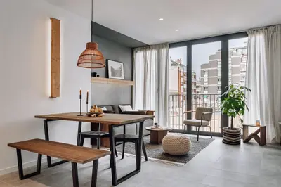 a living room with a couch and a table at Olite - 2 bedrooms in Eixample Esquerra in Barcelona