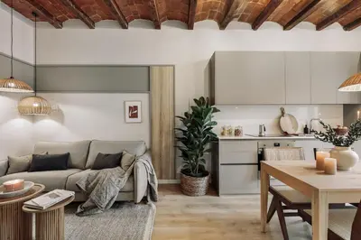 a bedroom with a bed with a mirror and a bed sidx sidx sidx at Caliu - 1 bedrooms and terrace in Sagrada Família in Barcelona