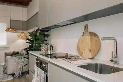 a kitchen with a sink and a counter top at Caliu - 1 bedrooms and terrace in Sagrada Família in Barcelona