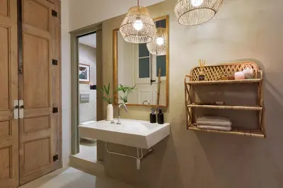 a bedroom with a bed and a table with a lamp at Batik - 2 bedrooms and terrace in Eixample Dreta in Barcelona