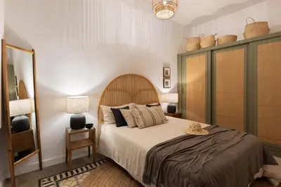 a living room with a couch and a table at Batik - 2 bedrooms and terrace in Eixample Dreta in Barcelona