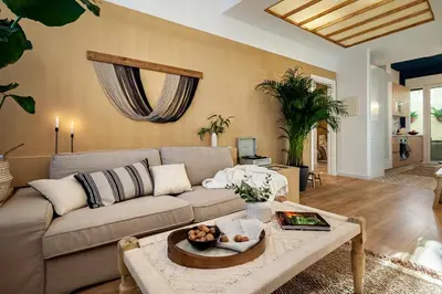 a bedroom with a bed and a table and a desk at Sahoro - 2 bedrooms and terrace in Gràcia in Barcelona