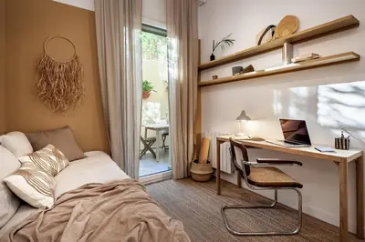 a bedroom with a bed and a potted plant at Sahoro - 2 bedrooms and terrace in Gràcia in Barcelona