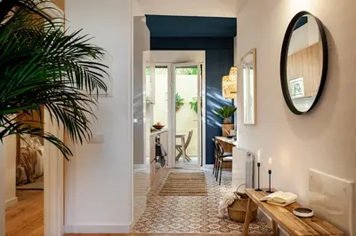 a bedroom with a bed and a desk and potted plants at Sahoro - 2 bedrooms and terrace in Gràcia in Barcelona