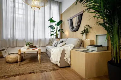 a living room with a couch and a table at Sahoro - 2 bedrooms and terrace in Gràcia in Barcelona