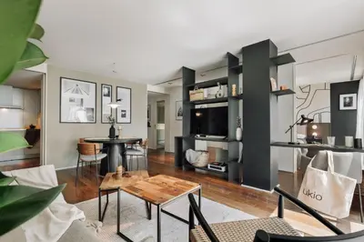 a living room with a table and a couch at Lewitt - 1 bedroom in Eixample Dreta in Barcelona