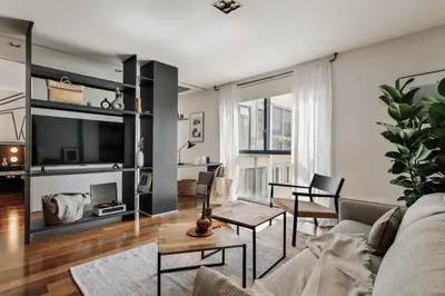 a living room with a couch and a table at Lewitt - 1 bedroom in Eixample Dreta in Barcelona