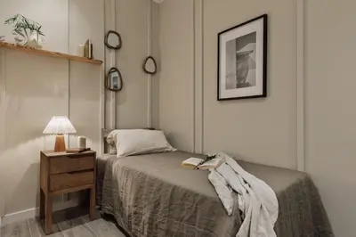 a living room with a bed and a window at Caris - 2 bedrooms and balcony in Les Corts in Barcelona