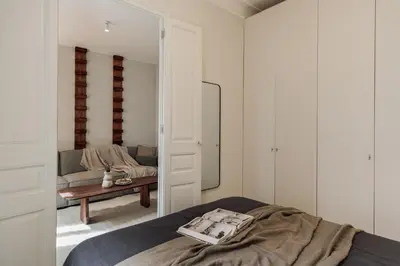 a living room with a couch and a table at Zafiro - 3 bedrooms and balcony in Sants in Barcelona