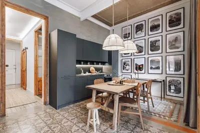 a kitchen with a table with a basket of vegetables at Tella - 2 bedrooms and office in Eixample Esquerra in Barcelona