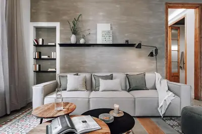 a living room with a couch and a table at Tella - 2 bedrooms and office in Eixample Esquerra in Barcelona