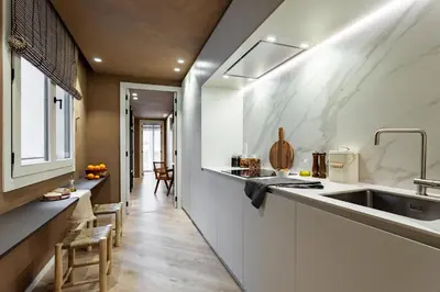 a living room with a couch and a tv at Hamid - 2 bedrooms in Eixample Dreta in Barcelona