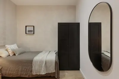 a living room with a couch and a tv at Sazos - 2 bedrooms in Sant Antoni in Barcelona